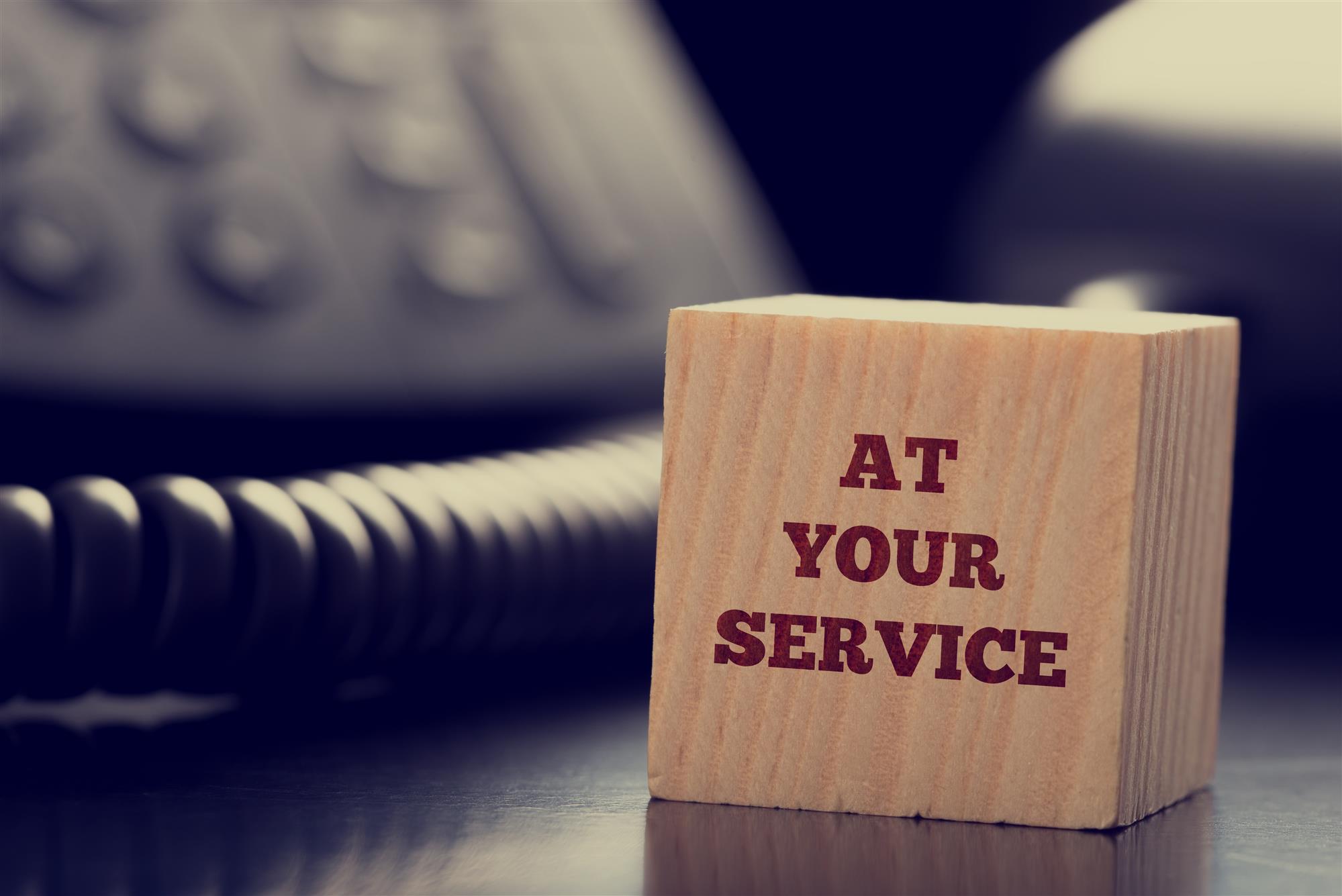 Wood Block that says "at your service"