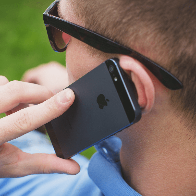 Man practicing active listening on an apple phone