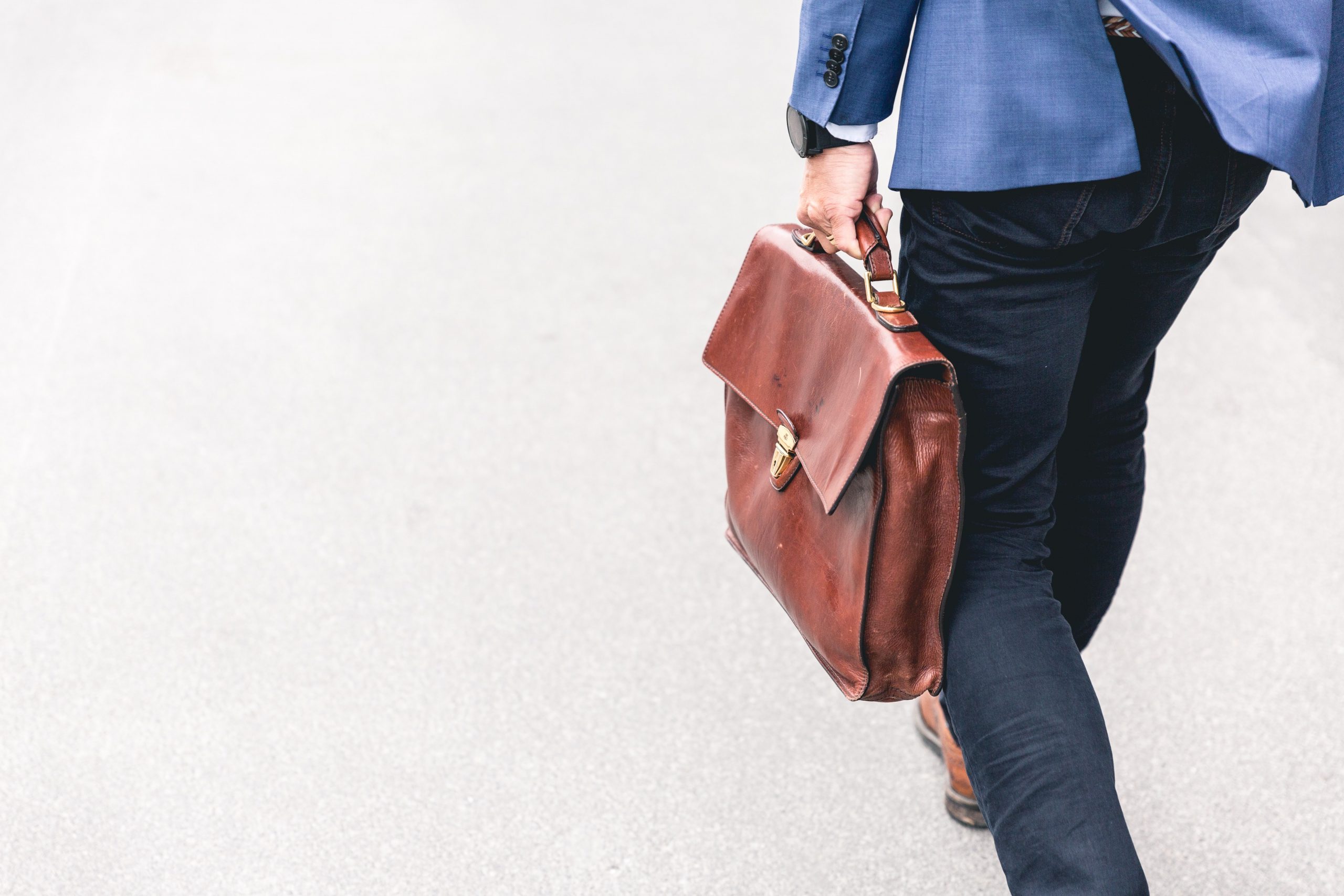small business owner walking with a briefcase