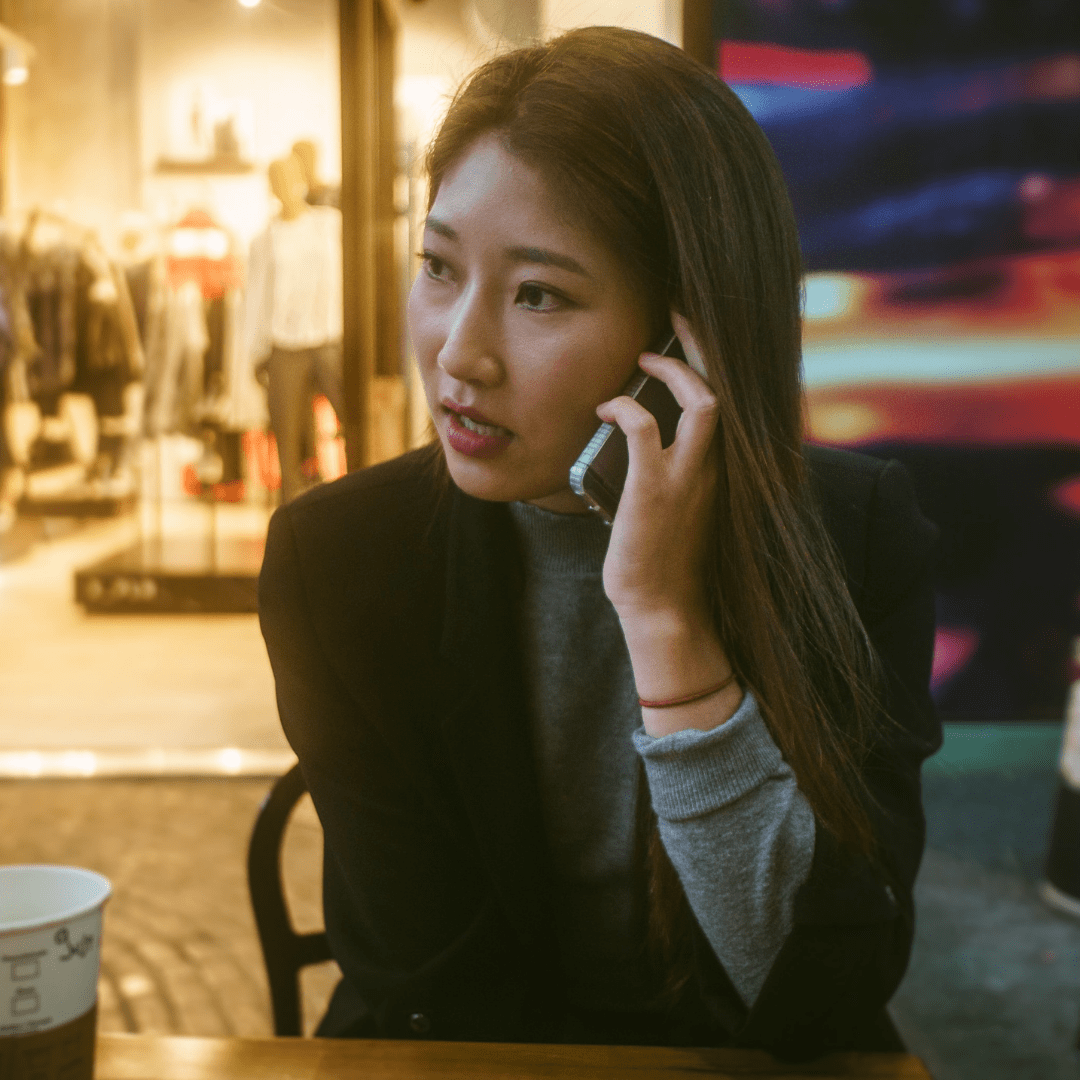 Woman talking on the phone with a Business Phone Answering Service