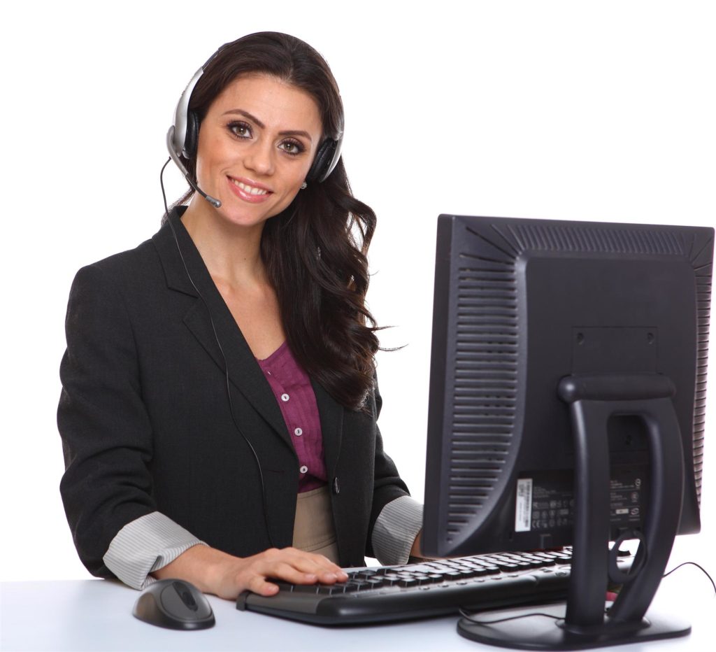 smiling young female call center agent working with a laptop