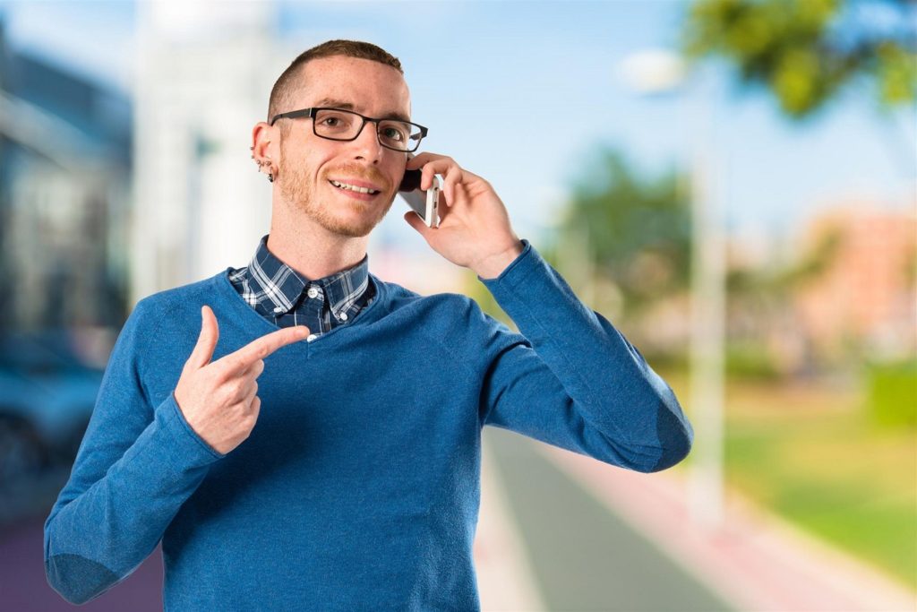 man posing while on call