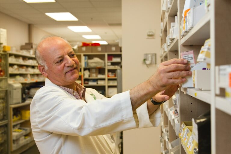 image of a busy pharmacist in a pharmacy symbolizing the importance of a pharmacy answering service