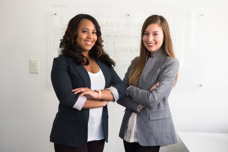 image of two professional women who are experienced in the ways of an answering service for property management