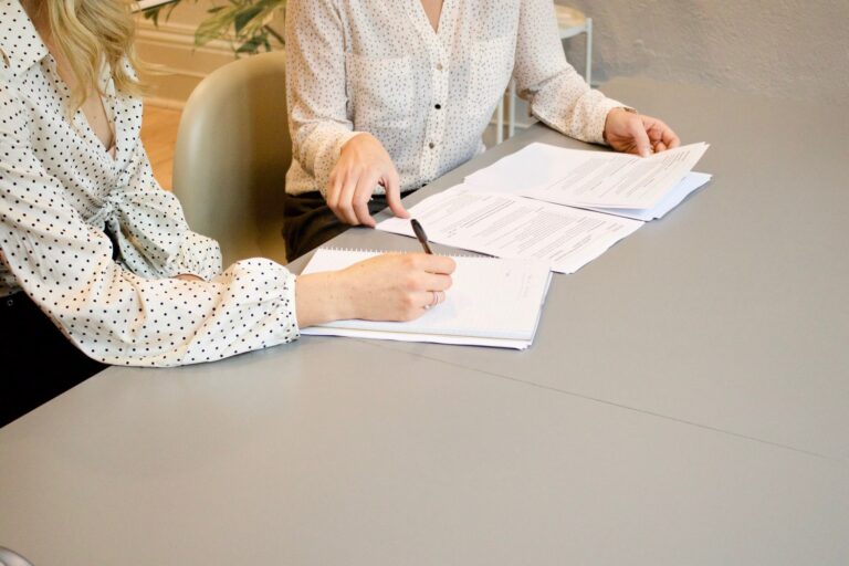 image of lawyers going through paperwork demonstrating freed up time when you utilize a legal call center for your law firm