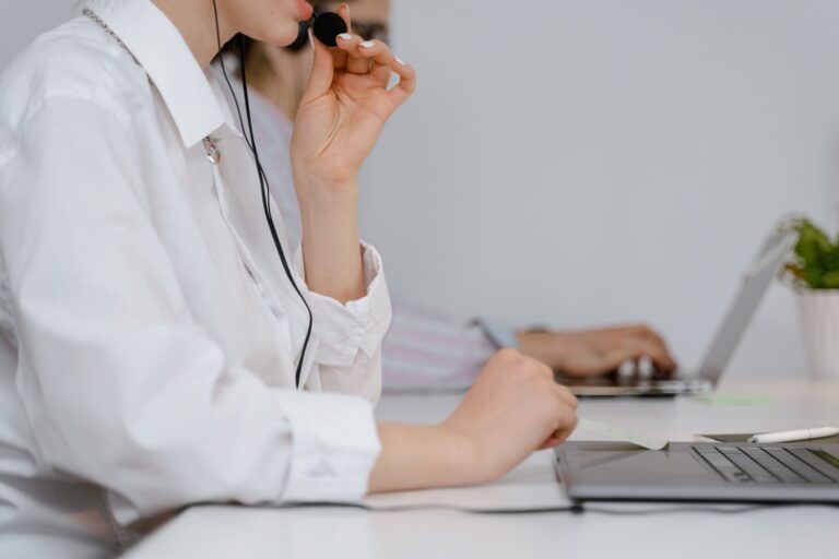 image of a woman who works with an HVAC Answering Service answering the phone