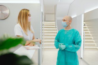 image of a receptionist and a surgeon free to talk because they have hired a medical call center