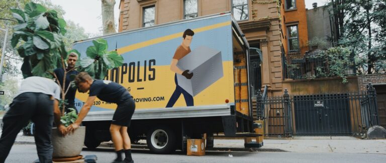 image of a moving truck and busy movers indicating the importance of getting help with appointment setting services