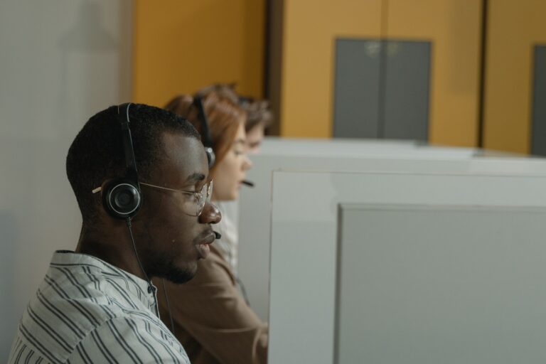 man on the phone conducting a patient satisfaction survey through a call center for healthcare