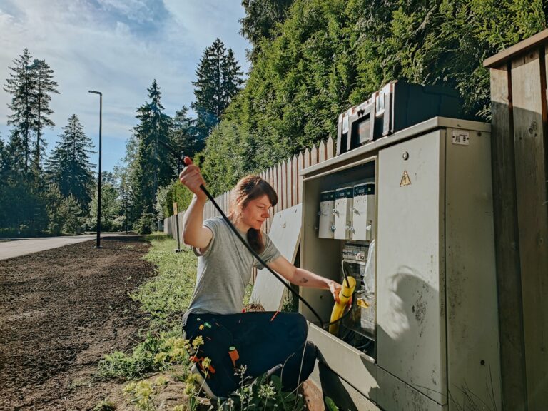 image of a female electrician working hard illustrating the need for an answering service for electricians to boost support